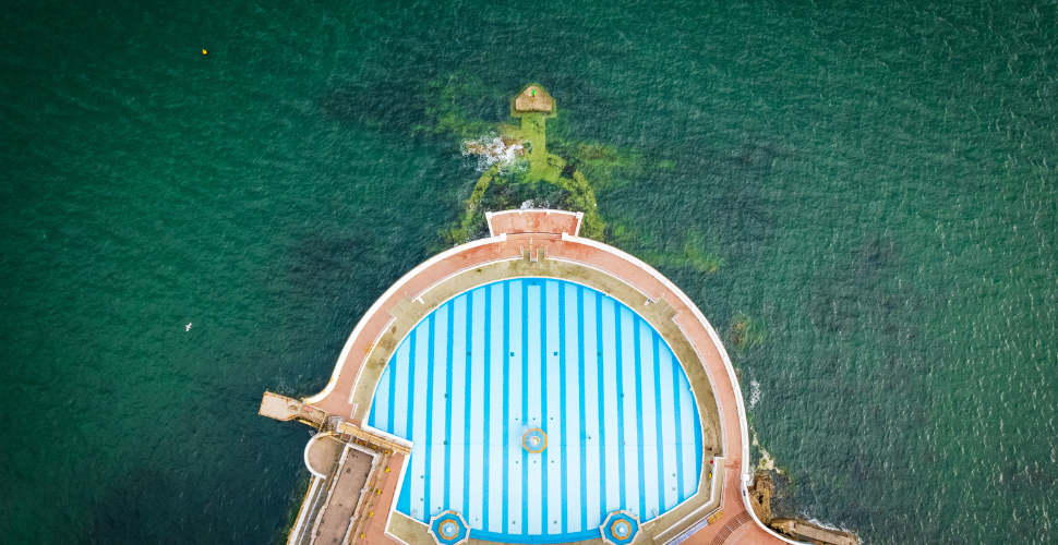 Tinside Lido in Plymouth from above with sea on either side 